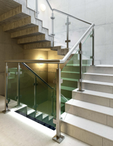 glass railing in a concrete stairwell
